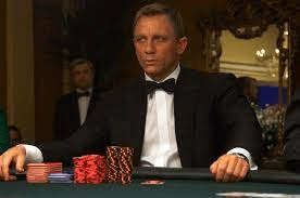James Bond staring at his opponent during a high stakes poker game.
